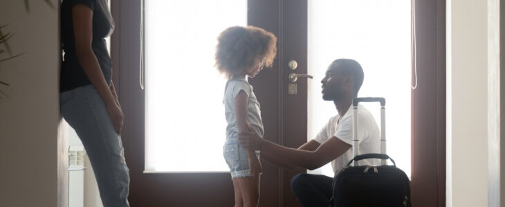 African dad talking to upset mixed race kid daughter leaving family with suitcase in hallway, black father saying goodbye to sad little girl, child of divorced parents and shared custody concept