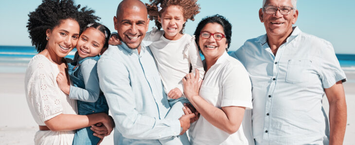 Parents, kids and grandparents on beach